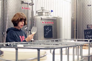 Winemaker Rori Mccaw observes and samples wine in a tank room at Cooper’s Hawk Vineyards in Harrow, Oct. 10. (Photo by/Gaebrielle Gomes)