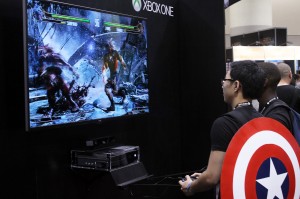 An attendee at the Toronto Fan Expo Canada 2013 plays a demo of Killer Instinct on the Xbox One, August 22. (Photo by Chris Mailloux)