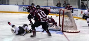 Vipers forward Dylan Denomme (left) scores a diving goal on Maroons goalie Darien Ekblad between Maroons defense (10) Nate Pietens and forward (7) Trevor Richardson during second period action at the Vollmer Recreational Complex Oct. 9. (Photo by/Phillip Beneteau)