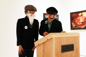 Alex Dougall, 10, and his brother Charlie, view one of the exhibits at the Art Gallery of Windsor during the Mysteries of the AGW! PA Day Party Oct. 11. Dougall dressed up as Leonardo da Vinci and Charlie as Salvador Dali for the event. (Photo by Sean Previl) 