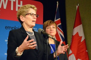 WINDSOR, ON.: Ontario Premier Kathleen Wynne (left) speaks to reporters Nov. 22 at the Giovanni Caboto Club while Windsor West MPP Teresa Piruzza (right) watches. (Photo by/Richard Riosa) 
