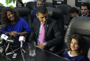 Mayor Eddie Francis, centre, with his family Michelle Prince, left, and daughter Sienna, 6, at a press conference at City Hall Jan. 10. Francis announced his decision to step down as mayor at the end of this term.