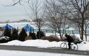 A local cyclist continues peddling on the bike trail  through Dieppe Gardens on Friday, January 24, 2014. Despite the extreme cold weather conditions, he is one of the very few people facing the cold today.