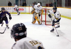 The Windsor Lancers fight for a much needed win in their game against the Laurier Hawks. (PHOTO by Jolene Perron)
