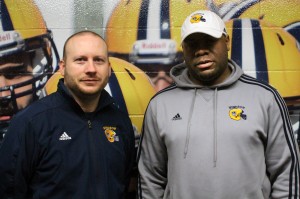 Head coach Joe D'Amore left and assistant coach Donovan Carter right pose in the Windsor Lancers dressing room. The Lancers footbal program is begingin to be knowm nation wide for the tough football regeimin. (Photo taken by Shaun Garrity)