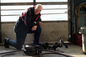 Allchin Break and Steering owner Rudy Fluit poses with auto parts damaged by potholes in his shop on Techumseh, Rd. in Windsor on Feb. 28. (photo by: Dan Gray)