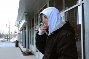 St. Clair College student Cody Raymond smokes in front of the MediaPlex in Windsor, Ont. on Feb. 28, 2014.  Raymond has smoked since the age of 13 because his grade school did not do enough to discourage him.  (Photo by Taylor Busch)