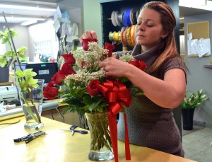Brandi Sullivan prepares floral arrangements for Valentine’s Day at Janette Florist Feb. 7.    (Photo by Bobby-Jo Keats)