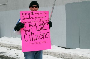 Local Windsorite supports the protest on Jan. 31 outside the Veteran's Affairs Canada Offices on University Avenue. (PHOTO by Clara Musca)