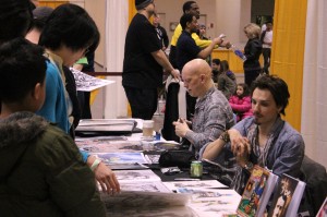  Windsor comic book artists David Finch (left) and Johnny Desjardins meet with fans and sign their work at the Toronto Comic Con March 9. (Photo by Chris Mailloux)