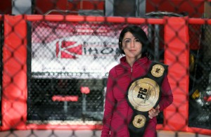 Randa Markos-Thomas holds her Provincial Fighting Championship belt at the Maximum Training Centre, March 21. (Photo by Chris Mailloux)