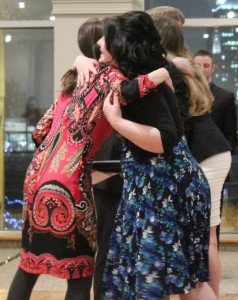St. Clair College journalism teacher Shelley Divnich-Haggert (left) shares a hug with second-year journalism student Jolene Perron (right) at the Journalism Awards Night on April 3, 2014. The photo was taken after Perron received her certificate as runner-up for the Most Dedicated to the Program award. (Photo by/Shelbey Hernandez)