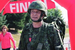 Major Mark Douglas stands near the finish line after completing his annual battle fitness test. His unit, the Essex and Kent Scottish Regiment participated in the fourth annual Trot with the Troops on Sept. 20 in Windsor. ( Photo By: Dan Gray )