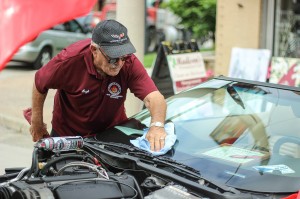 Hugh Pillon wipes off the windshield of his 1996 Chevrolet Corvette before the start of the Wheels On Wyandotte Car and Motorcycle Show on Wyandotte Street in Windsor on Saturday, September 13. (The Converged Citizen Photo by / Justin Prince)