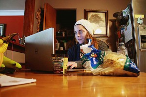 St. Clair College student Alex White eats junk food late at night at her home in Tecumseh on Oct. 1.  (Photo By/Taylor Busch)