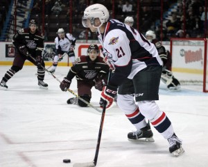 Windsor Spitfires' rookie centre Logan Brown makes a pass during second period action against the Peterborough Petes at the WFCU Centre Oct. 9. Windsor defeated the Petes 5-4 in overtime. Brown had a pair of assists in the win. (Photo by/Justin Prince)