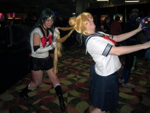 Sailor Pluto (Left) pulls on the hair of Valerie Wallace as Sailor Moon at last year’s Youmacon in the Gaming Room at the Renaissance Center in Detroit, MI. on Friday, November 1, 2013. (Photo By/Carrie Shrei)