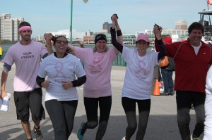 Run for the Cure participants cross the finish line at Riverfront Festival Plaza on Oct. 5.