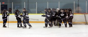 Durham West Lightning celebrates their victory over the Southwest Wildcats at Forest Glades Arena, Saturday Oct. 5, 2014. (Photo By Ryan Turczyniak)