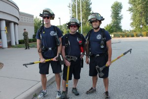 Windsor firefighters Kieran O'Rouke, Jeremi Taylor and Nick Stroesser stand in front of the Tilston Armoury and Police Training Centre preparing to participate in the 4th annual Trot with the Troops 13 kilometre Battle Fitness Test on Saturday, September 20, 2014. (Photo by Dan Gray)