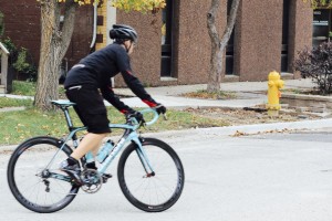 City Cyclery employee Oliver Swainson test rides a Bianchi road bike in Walkerville on Oct. 18, 2014. (PHOTO BY/TECUMSEH MACGUIGAN)
