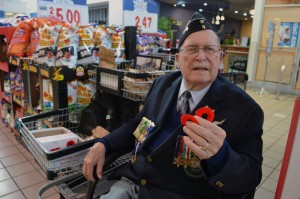 Second World War veteran Arthur Anderson distributes poppies in The Real Canadian Superstore on Dougall Avenue in Windsor on Nov. 7. (Photo by Allanah Wills)