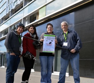 Photo by David Dyck From left to right, Jef Casteneda, Helen Medel, Laurie Harrison and Bill Chapman pose with an advertisement and some hockey gear outside the Mediaplex on November 7, 2014