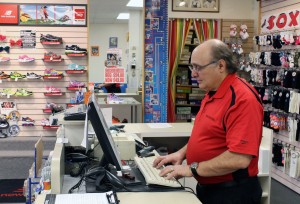 Arnold Blaine, owner of Karens 4or Kids, places orders for new products for his store on Ottawa Street in Windsor on Nov. 7. (The Converged Citizen Photo By/Tyler McMenemy)