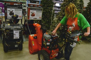 Kathy Mero Home Depot associate shows how to fill up the gas chamber in a snow blower