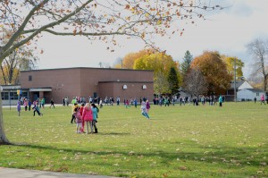 Students at Notre Dame Elementary school are playing in the schoolyard on Friday, November 7, 2014. (Photo by Luke Gangnon)