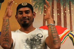 WINDSOR,Ont(14/12/03) - Leamington, Ontario receives the most Mexican workers in all of Canada. Joel Dominguez, 33, is one of those workers. He shows his tattoos Oct. 13, 2014. He said sometimes the police confuse a person with tattoos as  a cartel gang member. That is why he chose to put his children on his arms. Photo taken by Shaun Garrity.