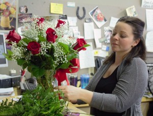 Brandi Sullivan arranges an early Valentine’s Day bouquet at Janette Florist in Windsor on Feb. 3, 2015 (Photo by Ashley Ann Mentley).