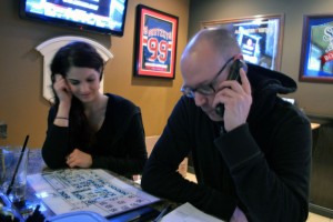 Bartender Amanda Ioannidis and Jason Noble, a server/manager at  the John Max sports bar location On Dougall  Ave. in Windsor are trying to find a balance between cancellations and  new reservations during Snowstorm Linus during Super Bowl Sunday, February 1, 2015.