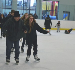 FEBRUARY 16 2015 LEAMINGTON ONTARIO--- Trevor Brown skates with his oldest daughter amid a sea of families enjoying the two hours of free skating at the Leamington Kinsmen Recreation Complex. PHOTO BY/DAVID DYCK  