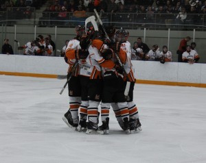 Members of the Essex 73’s celebrate a goal during Game 6 of the GLJCHL championships at the Libro Centre in Amherstburg on March 13, 2015. The 73’s advanced to the semi-finals of the OHA Schmalz Cup for the fourth consecutive year after sweeping the Exeter Hawks 4-0 in the quarter finals of the OHA championships. PHOTO BY CHRISTIAN BOUCHARD