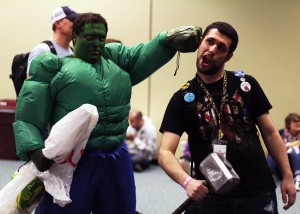 Tornto, Ont:: (3/21/2015) A man cos-playing the Incredible Hulk pretends punch a convention goer carrying Thor's hammer during the Toronto Comic Con, March 21. 