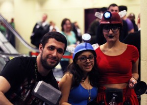 TORONTO, ONT :: (3/21/2015) A man holding Thor's hammer poses with two girls in Doctor Who themed cos-play during the Toronto Comic Con March 21. 