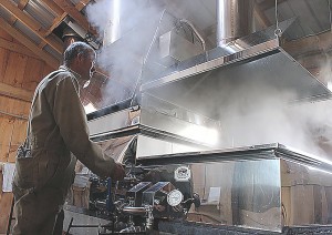 DRESDEN, ON. MARCH 17, 2015- Earl Elgie adjusts the evaporator in his sugar shack in Dresden Ont. on Tuesday, March 17, 2015. The evaporator is boiling the sap down to a thick, dense liquid which will eventually be bottled as maple syrup. (Photo By Julia Poehlman)