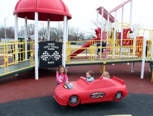 Children play at the automotive-themed playground at Ford Test Track Park in Windsor, April 14, 2015.  The playground's theme pays homage to the site's past as a track for the Ford Motor Company. (PHOTO/Mark Brown)