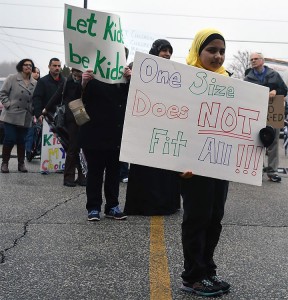 ESSEX, ON. APRIL 8, 2015---A girl holds a sign protesting the new sex education curriculum at the rally in Essex on North Talbot Road. 