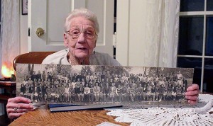 Jeanne Brown, 93, holds a photo of the Harrow District High School class of 1939. Brown was part of the first group of students to attend the school. (Photo by Ashley Ann Mentley)