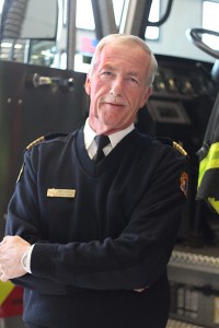 Windsor Ont. (10/29/15) – Windsor Fire and Rescue Services Chief Bruce Montone poses for a photo in front of Truck 1 on Thursday, Oct. 29, 2015. Montone said Windsor Fire is working hard to address their budget shortfall. Dan Gray,The Converged Citizen