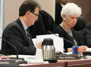 Windsor Councilor's Paul Borrelli and Jo-Anne Gignac go over ther paperwork during the meeting of City Council on Thursday, Oct. 29, 2015. The pair voted to have a municiple auditor general appointed at the provincial level. Photo by Dan Gray, The Converged Citizen.