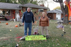 Roch and Rachelle Ethier stand in their front yard filled with Halloween decorations on Oct. 19 2015. The decorations and pumpkins are a memorial for their son Daniel. 
