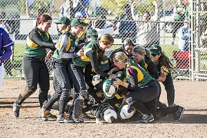 The St. Clair Saints celebrate at home plate after infielder Sarah Bondy hits the walk-off hit to win the championship at Durham College, in Oshawa Oct. 11(PHOTO COURTESY OF ST. CLAIR COLLEGE) 