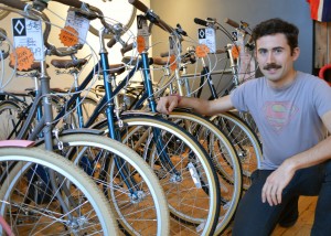 Oliver Swainson, mechanic and salesperson at City Cyclery is pictured at City Cyclery on Thursday, Nov. 12. (Photo by Sean Frame) 