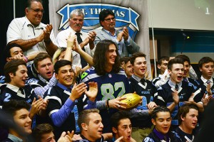 Luke Willson (82) presents the golden football to his former high school, St. Thomas of Villanova on Nov. 6, 2015. Willson is one of 15 Canadians to appear in a Super Bowl in its 49 years of existence. (Photo by Christian Bouchard)
