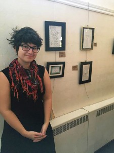 Brittni Carey, barista at Green Bean Café, poses with her poetry on Nov. 13, 2015