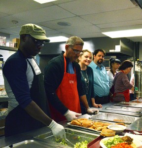 NOVEMBER 27 2015 WINDSOR ON---Standing third and fourth from the left, Fiona Coughlin and Ron Dunn help serve food at the lunch counter at the Windsor Downtown Mission on November 27,2015. PHOTO BY/DAVID DYCK 