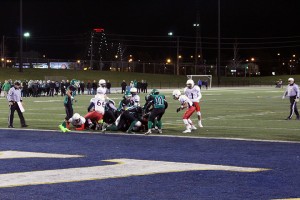 Herman and Holy Names player pile at the goal line during the Newman conference finals. 